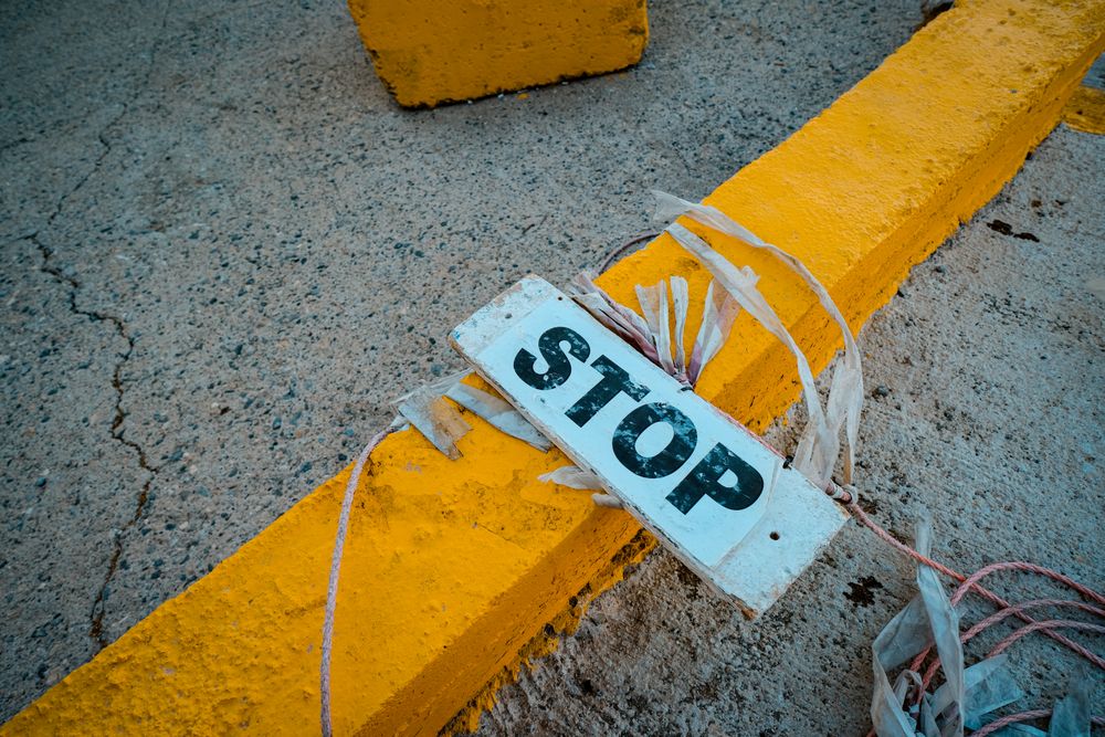 Warning sign meaning danger or stop, a reminder to stop at the first failed check when choosing an urgent cash loan provider