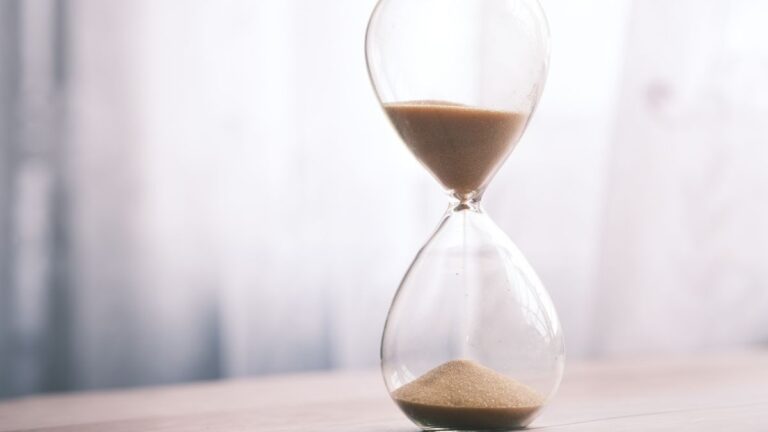 Clock and hourglass showing time running out